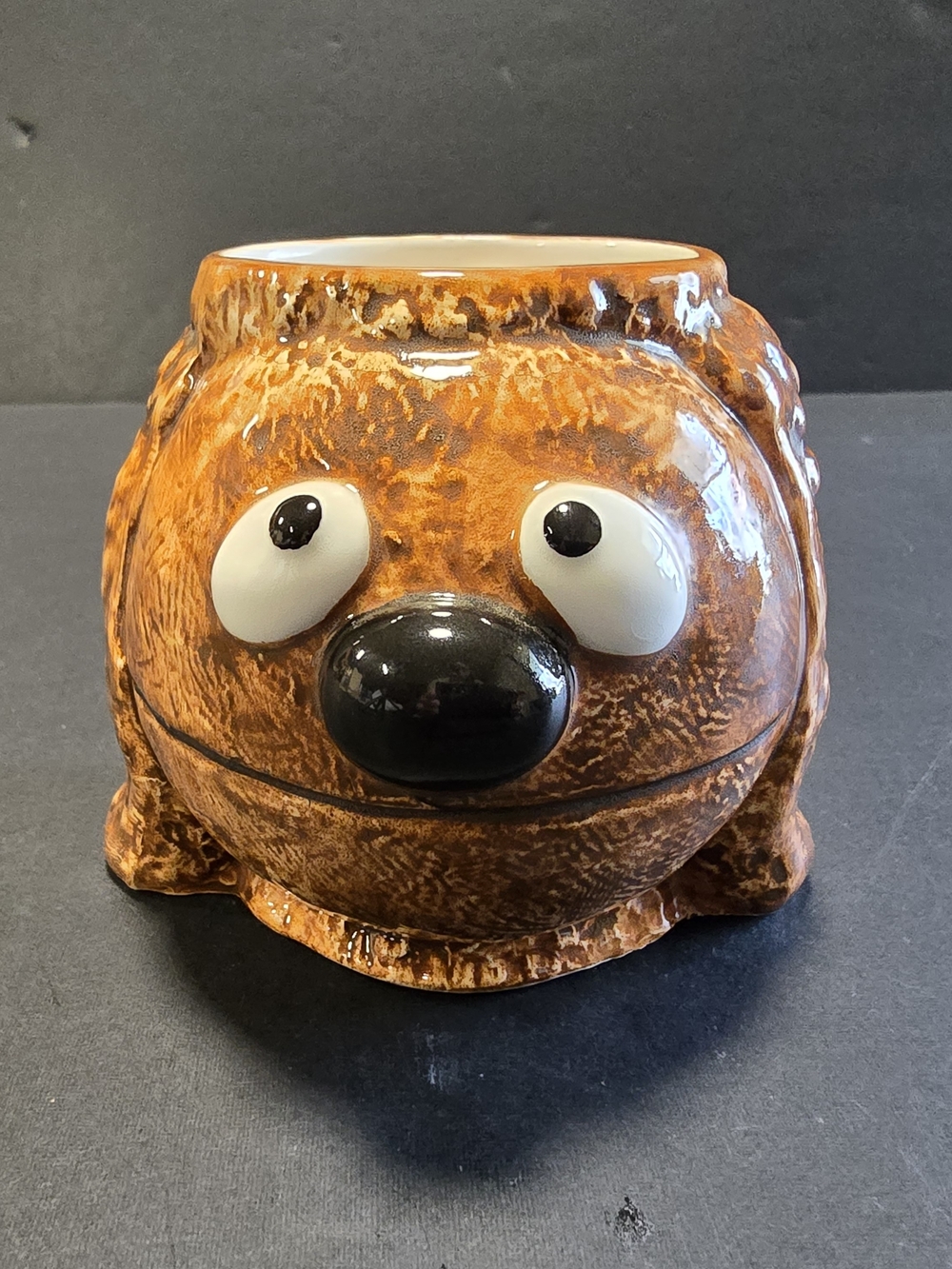 Whimsical Brown Ceramic Mug with Playful Face